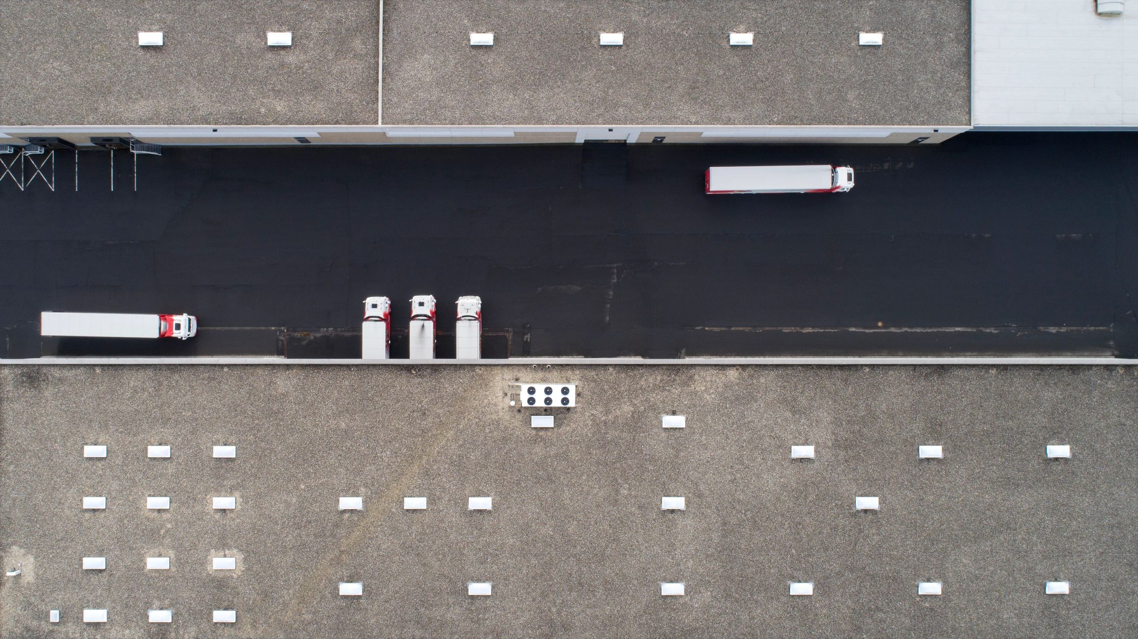 Logistics facility image used as testimonial avatar placeholder