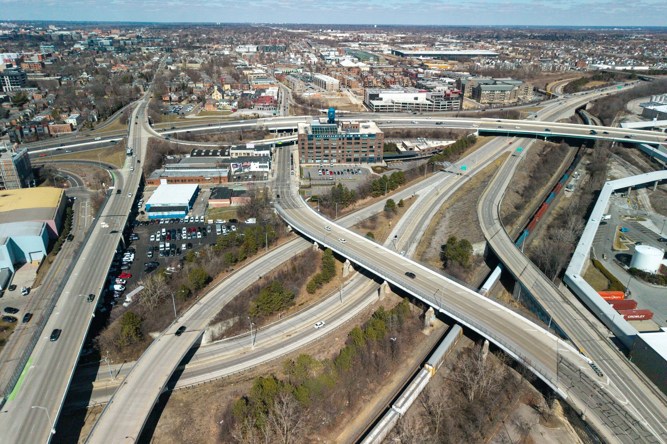 Aerial view of a highway interchange and rail line